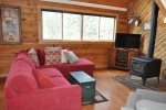 Living Room with flat screen TV, wood stove